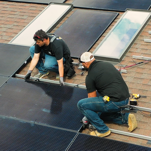 RALOS Employees on Roof Top Installing PV Panel